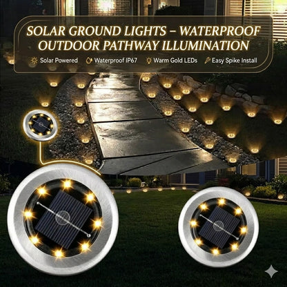 Solar ground lights illuminating a pathway at night